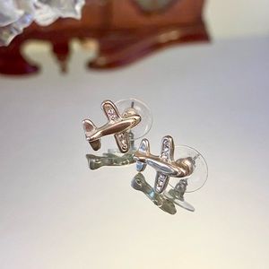 silver airplane stud earrings